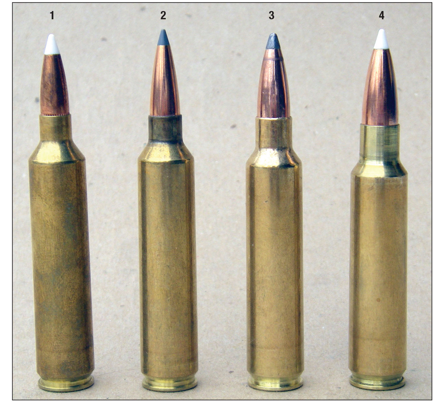 Nosler cartridges include (left to right): .26, .28, .30 and .33. Note the shoulder datum differences between the .26 and .28 compared to the .30 and .33.